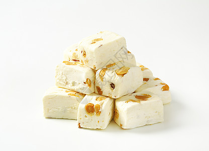 白色软诺瓦立方体蜜饯食物水果坚果蜂蜜花生干果糖果背景图片