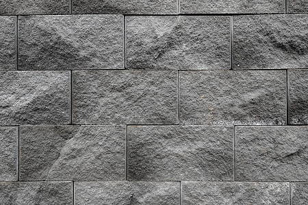 灰墙表面使用许多砖块 或者旧的黑砖墙抽象图案石方石头建筑城市墙纸房子古董材料石工地面图片