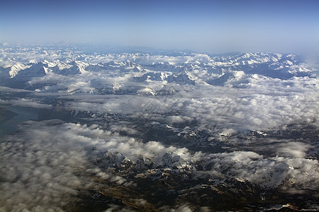 瑞士阿尔卑斯山高雪山顶岩石蓝色冰川飞行高山天空森林旅行航班顶峰图片