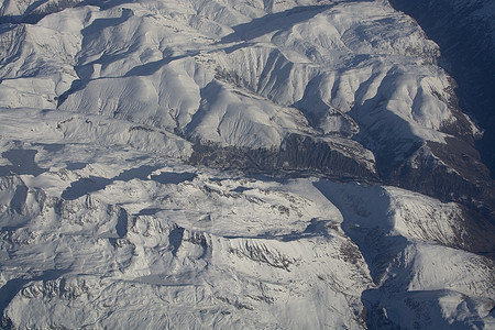 瑞士阿尔卑斯山高雪山顶天空飞行顶峰滑雪天线爬坡荒野风景冰川高山图片