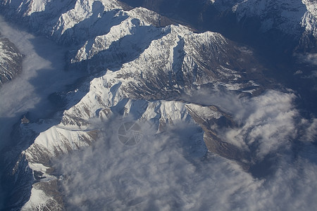 瑞士阿尔卑斯山高雪山顶爬坡天空旅行航班天线蓝色山脉高山飞行岩石图片