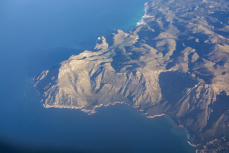 西班牙马洛尔卡海风海岸景观石头悬崖阳光蓝色海洋港口旅行海浪晴天天空图片