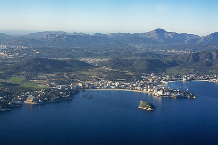 西班牙马洛尔卡海风海岸景观蓝色支撑岩石海洋阳光天空太阳海景海岸港口图片