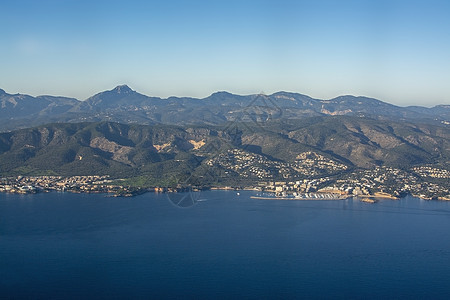 西班牙马洛尔卡海风海岸景观岩石风景港口支撑太阳天线天空悬崖蓝色海岸线图片