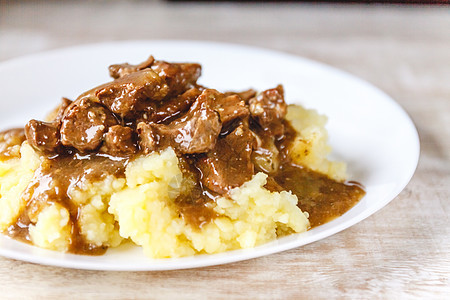 烤牛肉 牛排加肉汁 在马铃薯泥上乡村蔬菜牛肉桌子糊状物土豆食物午餐洋葱猪肉图片