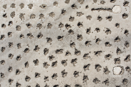 作为背景纹理的凹陷的岩石或石头表面宏观摇滚灰色地面墙纸石灰石花岗岩材料土壤矿物图片