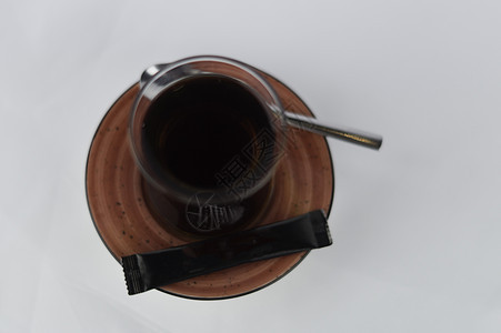 白地糖和勺子上一杯茶玻璃早餐飞碟食物液体饮料咖啡地面咖啡店黑色图片