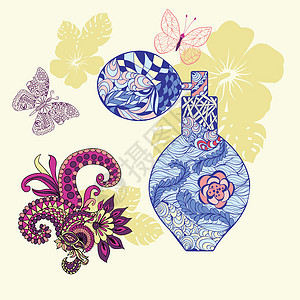 香水瓶和有鲜花和蝴蝶的背景图片