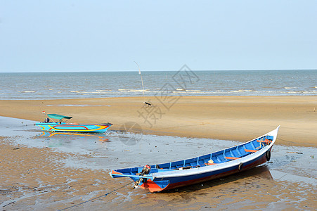 渔船木制渔船运输文化港口热带海滩日落天空支撑海洋木头图片
