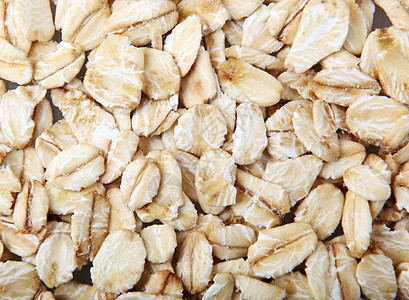 卷燕子是一种轻度加工的全谷物食品稀饭小麦农业拼写小吃薄片植物棕色麦片早餐图片