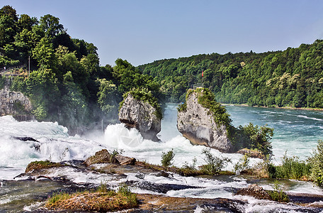 瑞士莱茵瀑布波浪飞溅岩石绿色下降图片