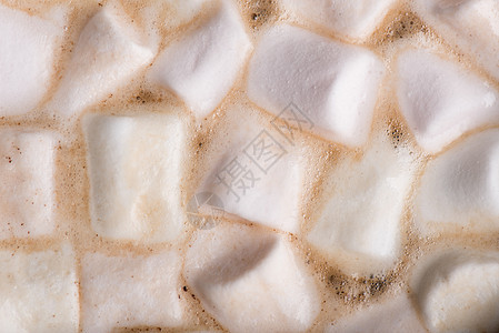 巧克力背景中的棉花糖图片