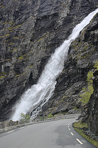 挪威的长城巨魔岩石山脉蔬菜冰川悬崖天空瀑布图片