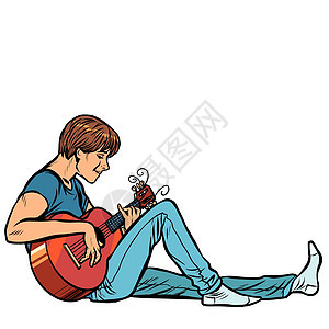 年轻的少年男子演奏原声吉他图片