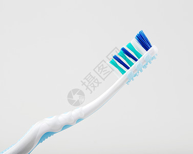 白色背景下的塑性牙刷化妆品药品塑料卫生医疗保健医学牙齿工具摄影图片