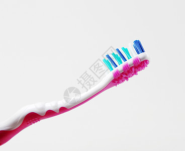 白色背景下的塑性牙刷保健塑料蓝色牙齿牙刷生活方式医疗卫生药品刷子图片
