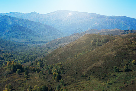 山上美丽的一天土地森林场景日出旅游植物山脉季节太阳国家图片