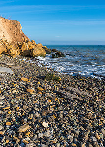 黑海边缘的岩石海景海潮太阳悬崖季节蓝色晴天波浪海滩乡村图片