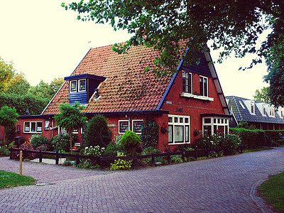 荷兰现代带棕砖房的现代化排房天空细胞太阳旅游房子村庄地标住宅旅行建筑学图片
