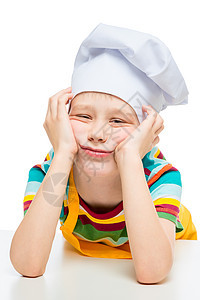 10岁穿戴帽子扮白背景的悲伤厨师图片