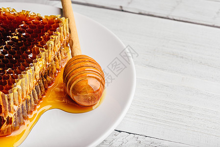 蜂蜜糖盘和蜂蜜薄饼蜂窝食物橙子甜点味道养蜂业治疗乡村细胞调味品图片