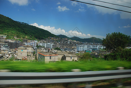 中国村车行驶车辆的风景图旅行房屋全景房子乡村村庄爬坡绿色城市天空图片