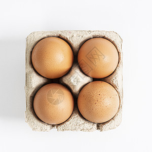 容器中的鸡蛋紫色烹饪纸板包装蛋壳纸盒棕色早餐农场白色图片