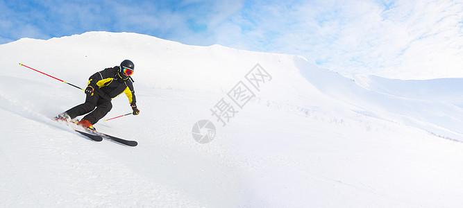 高山的滑雪者行动天空乐趣活力成人娱乐冻结季节男人速度图片