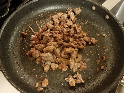 用烤锅煮地牛排烹饪食物午餐煎锅牛肉地面平底锅油炸图片