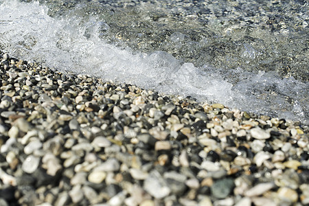 鹅卵石海滩海岸线假期海岸卵石蓝色白色海浪海洋岩石支撑图片