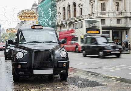 在伦敦的出租车王国运输民众旅行汽车街道城市橙子水平黑色图片