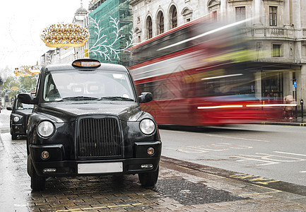 在伦敦的出租车旅行街道黑色城市民众运输商业汽车水平王国图片