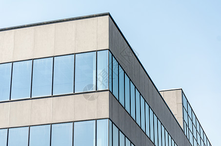 有空窗口的灰色混凝土建筑石头墙壁角落窗户背景玻璃城市街道蓝色积木图片