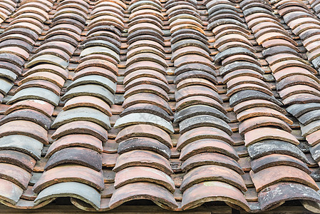 越南北部古屋的彩色弧形粘土瓦屋顶水泥材料寺庙黏土热带平铺海浪房子瓦片文化图片