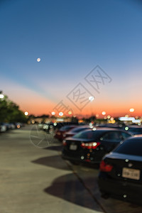明日夕阳在得克萨斯州休斯敦市购物中心停车场建筑吸引力商业背景出口市场标识房地产建造娱乐图片