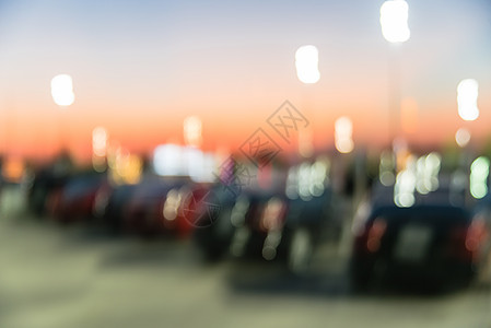 明日夕阳在得克萨斯州休斯敦市购物中心停车场商业零售经济店面标识日落建造奢华沥青车辆图片