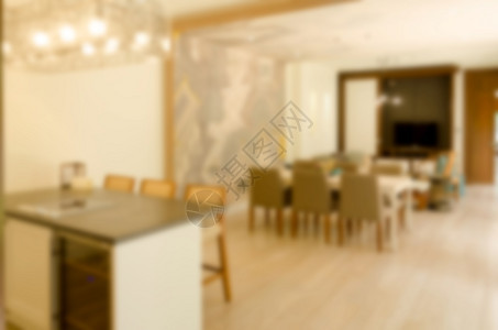 模糊的抽象起居室房间公寓白色沙发家具背景图片