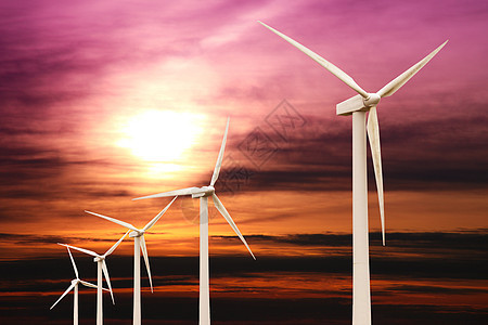 日落时的风力涡轮机植物发电机环境生态活力天空螺旋桨光伏涡轮背景图片