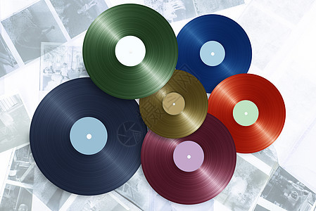 彩色背景的乙烯基唱片音乐立体声打碟机盘子记录专辑光盘图片