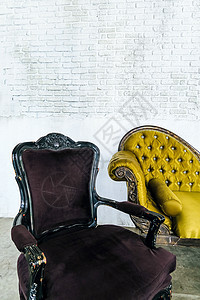 在砖墙背景的古色古香的沙发酒店家具风格扶手椅装潢石头皮革古董建筑学建筑图片
