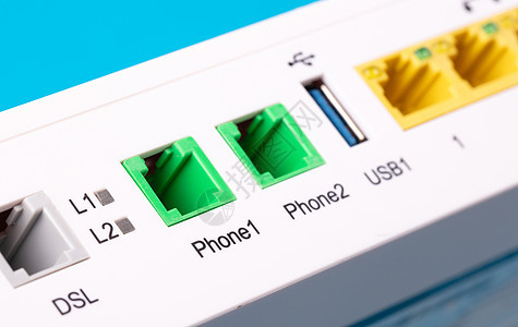 桌面家用 ADSL 调制解调器 选择性焦点白色电缆蓝色力量背景数字用户线盒子天线宽带图片