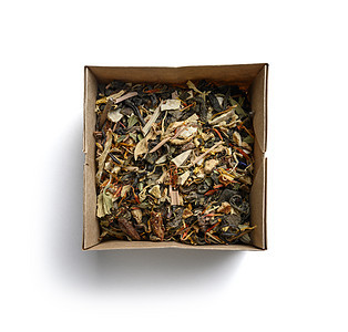 绿色茶 含有芳香添加剂 白底的顶端视图芳香香气饮料杯子茶点盒子花瓣早餐叶子桌子图片