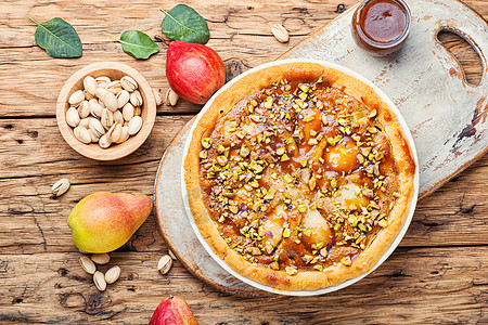 有梨子的秋季馅饼桌子食物糕点甜点面包脆皮开心果烘烤蛋糕水果图片