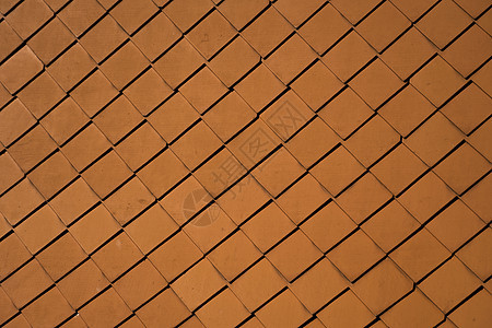 建筑物上的天然橙色屋顶瓦片作为纹理金属瓦楞房子钻头紧固件制品陶瓷钻孔工匠建筑图片
