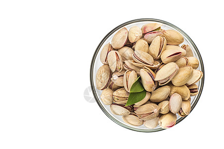白底玻璃碗里的Pistachios小吃叶子盐渍食物团体活力种子核心坚果营养图片