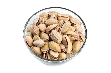 白底玻璃碗里的Pistachios核心坚果叶子营养开心果种子小吃食物团体活力图片