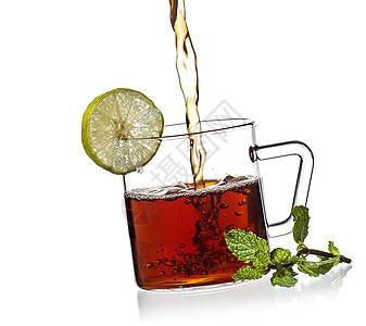 白底杯茶 薄荷和柠檬食物茶壶味道玻璃杯子饮料植物芳香早餐蒸汽图片
