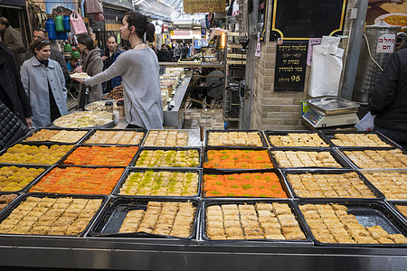 耶路撒冷苏克的糖果甜糖地标食物旅游女士市场购物店铺游客露天摊位图片