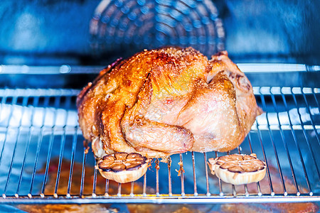 烤鸡和大蒜烹饪油炸皮肤厨房食物烤箱棕色家禽翅膀美食图片