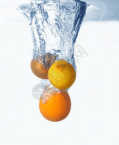 水中的水果液体运动涟漪气泡蓝色海浪果汁生活柠檬橙子图片